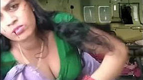 Atashi Roy, a milky-skinned housewife from Marwadi, reveals her cleavage and navel in a seductive display