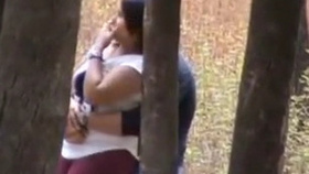 Audacious college sweetheart performs a risky oral sex act in an outdoor public space