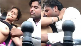 Arousing Indian couple passionately fondles each other's breasts in a vehicle