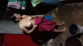 Indian village wife takes evening bath