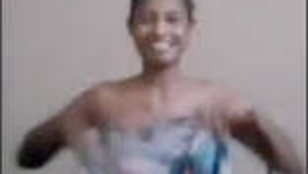 A Sri Lankan woman proudly displays her large breasts