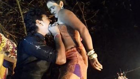 Indian girl's sensual stage performance with baring breasts and intimate contact