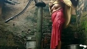 Indian aunty's open-air bathing
