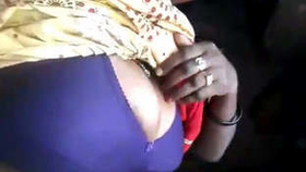 A village girl revealing her breasts and intimate parts