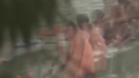 Tamil women bathing by the river