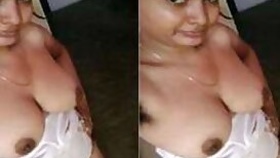 Female is Desi and feels free to perform XXX show of her breasts